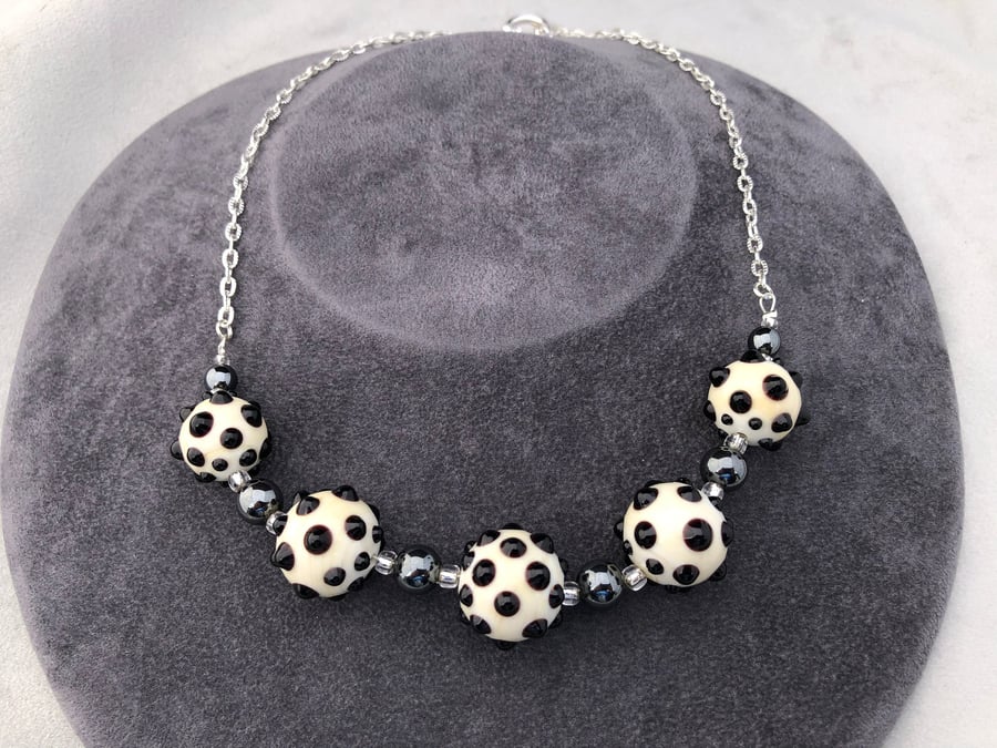 cream ivory and black lampwork glass beaded necklace with haematite stones