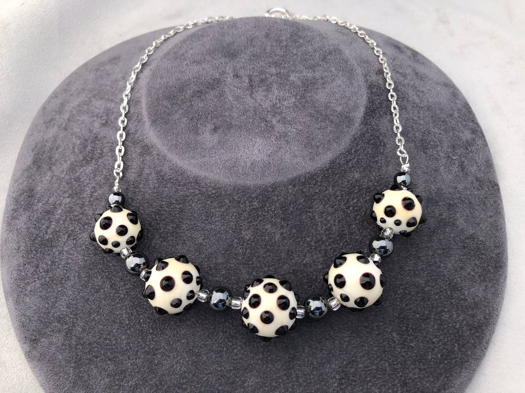 cream ivory and black lampwork glass beaded necklace with haematite stones