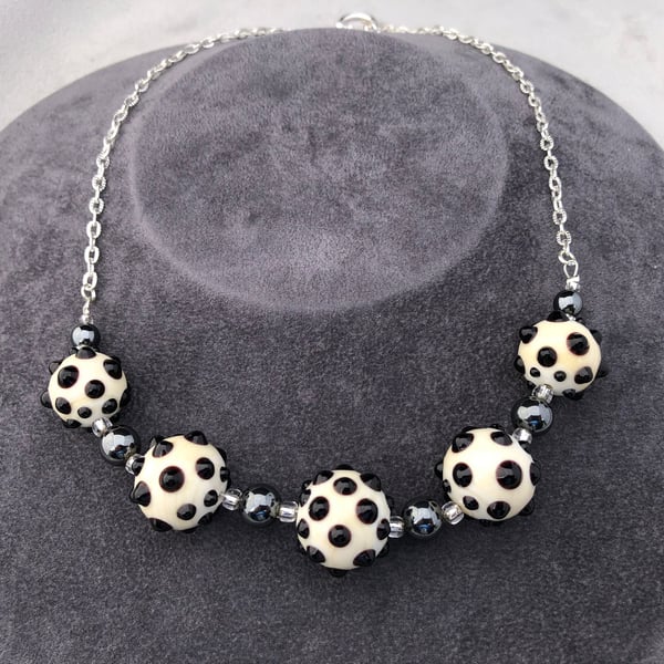 cream ivory and black lampwork glass beaded necklace with haematite stones