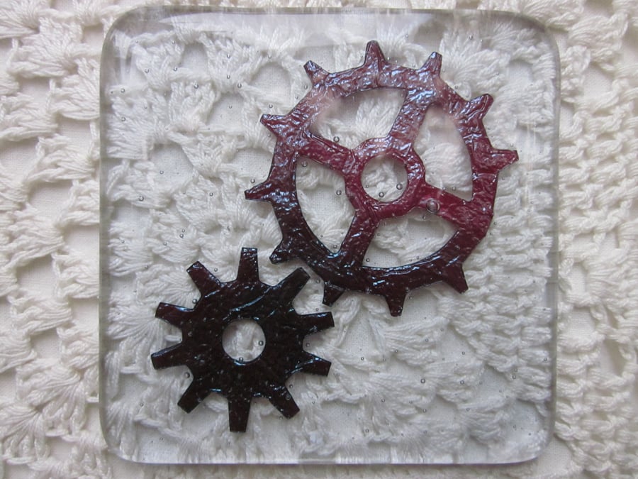 Handmade fused glass coaster - copper cogs on hint of purple tint