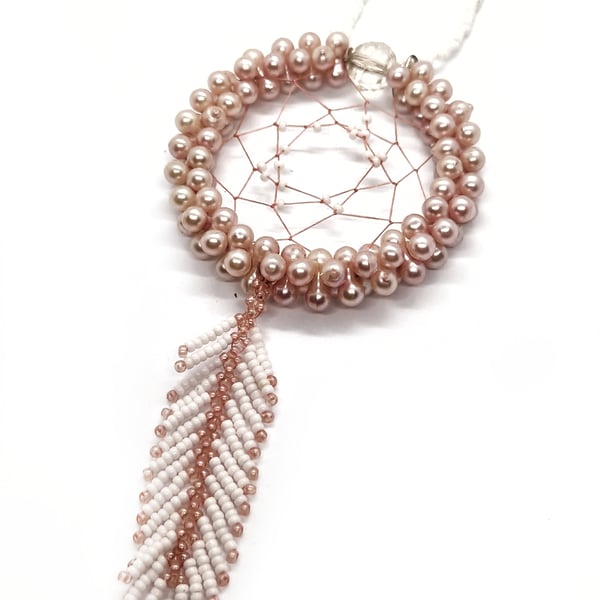 Small pink and white beaded feather dreamcatcher