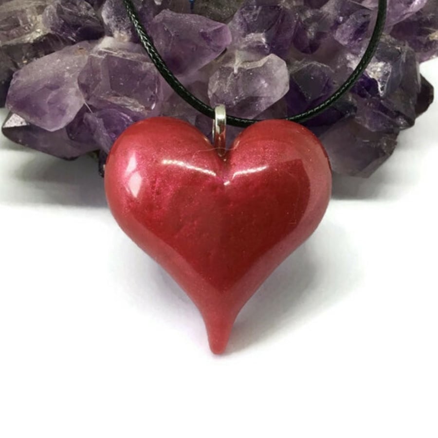Ruby red metallic puffy heart statement pendant with black cord necklace.