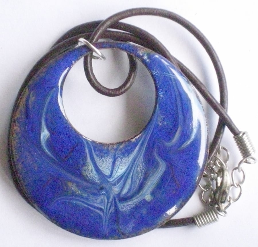 large pendant - pierced circle scrolled pale blue on dark blue over clear enamel