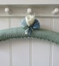 Clothes hanger coat hanger - pale green with crocus flowers