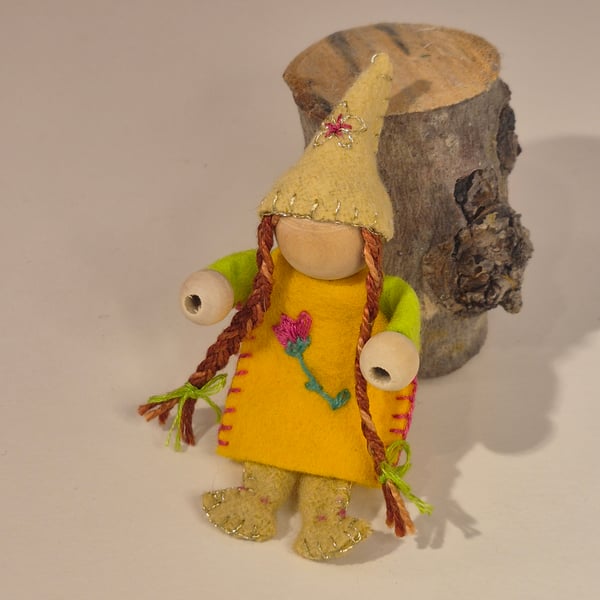 Bendy wire, wood and wool felt spring gnome with long, plaited brown hair