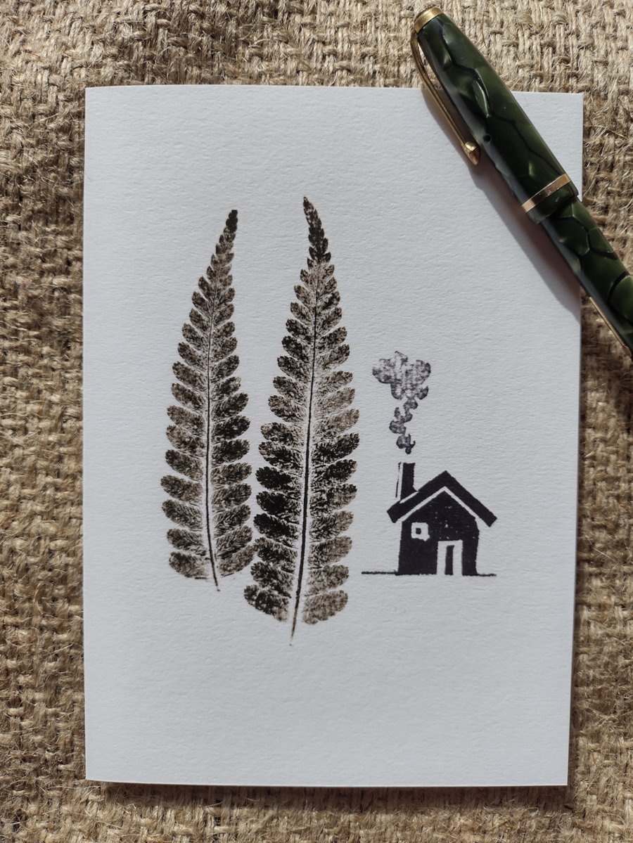 Cabin in the Woods. Image made on a printing press and hand made stamps.