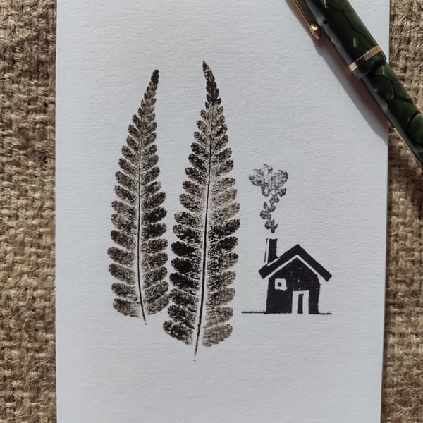 Cabin in the Woods. Image made on a printing press and hand made stamps.