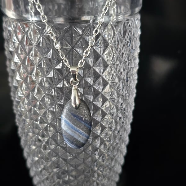Polymer clay oval necklace on a silver plated chain