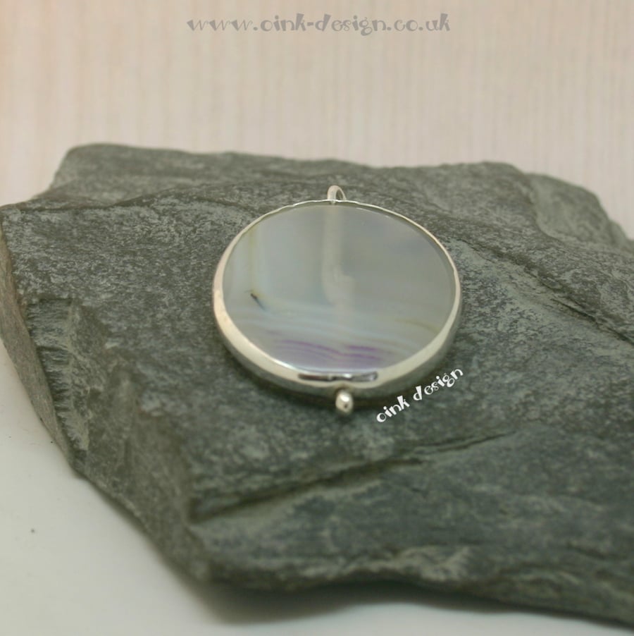 A simple piece of white and lilac agate set in sterling silver