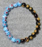 Pale Blue and Black-Amber Millefiori Bead Elastic Half and Half Bracelet - Image 1