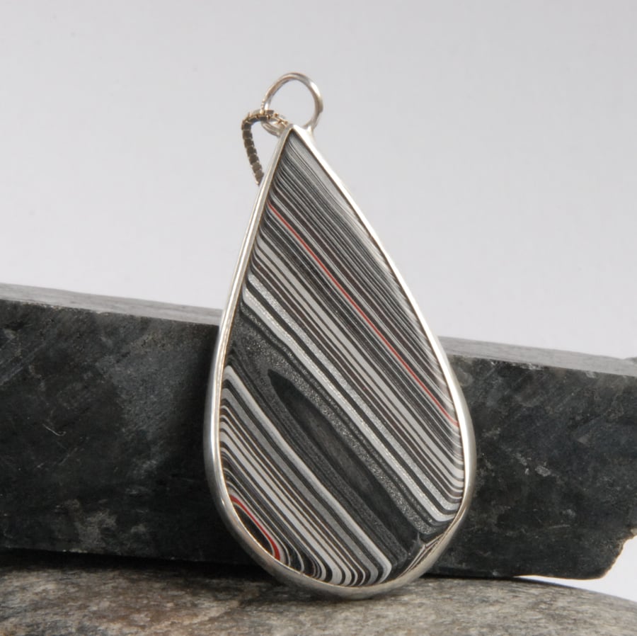 Sterling silver and monochrome detroit fordite pendant