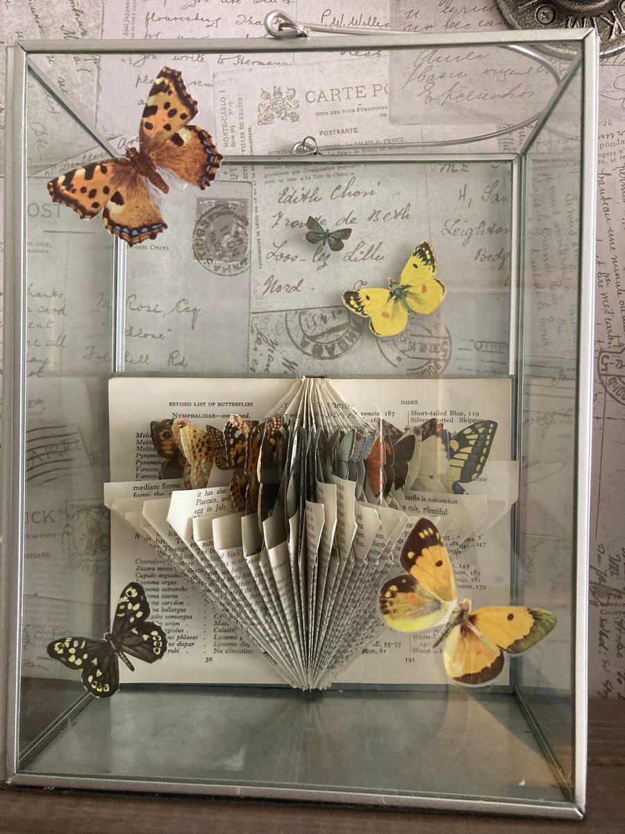 Observer book of butterflies sculpture