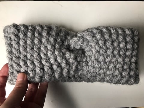 Hand knitted grey wool ear warmers with a decorative twist