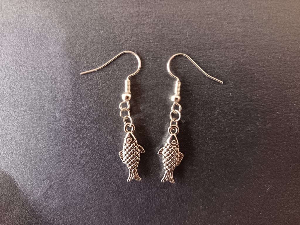 Silver fish charm dangle earrings 