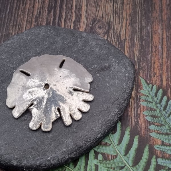 Real sand dollar seashell preserved in silver, beautiful ornament 