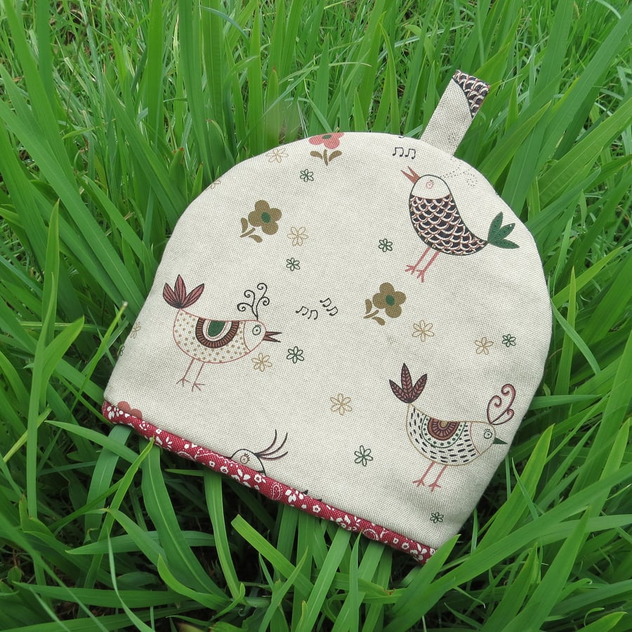 A tea cosy, size small.  To fit a 1- 2 cup teapot.  Chickens design.
