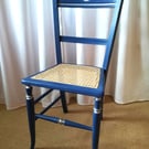 Antique chair upcycled in blue chalk paint, re-caned seat