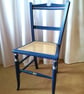 Antique chair upcycled in blue chalk paint, re-caned seat
