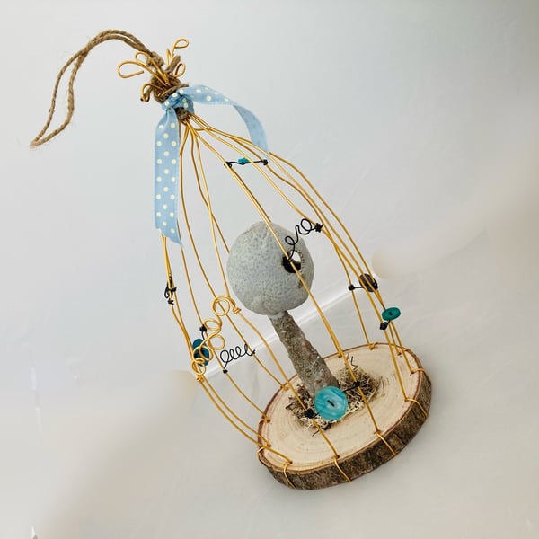 Wire bird cage with ceramic sculpture, fantasy art