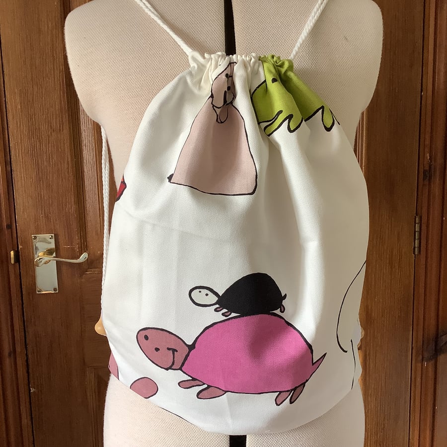 Child’s drawstring rucksack. Water resistant lining. Animal cartoon print