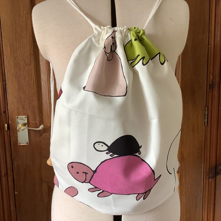 Child’s drawstring rucksack. Water resistant lining. Animal cartoon print