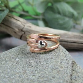 Copper wrap around ring with Sterling Silver Leaf Accent. Adjustable fit UK P-R