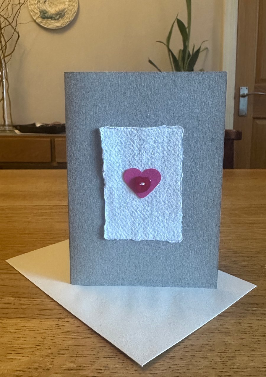 Greetings card with pink heart & red heart shaped button 