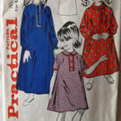 A vintage sewing pattern for a girl's long or short nightdress in size 8