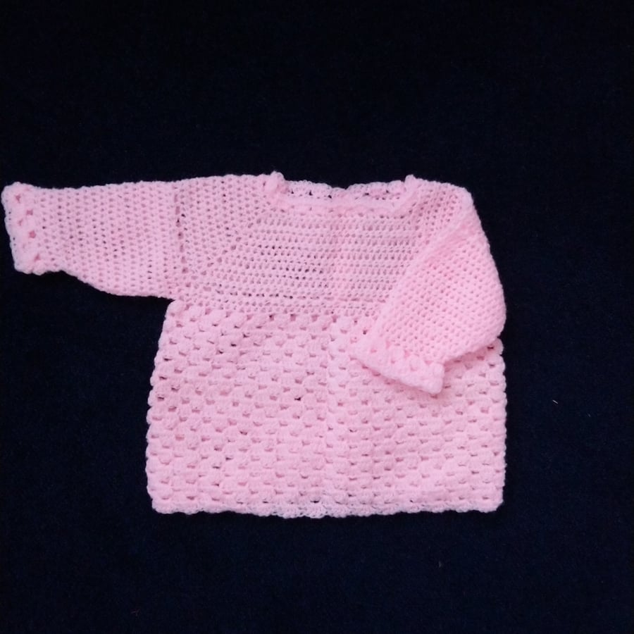 Pink crochet baby jumper. Pretty lacy baby jumper