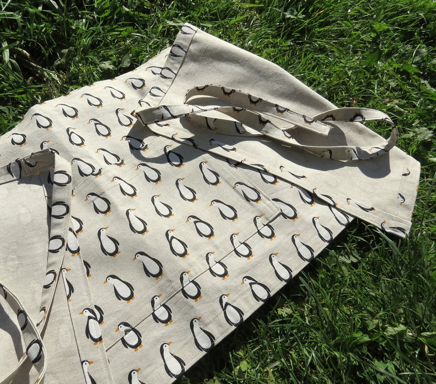 A wraparound apron.  Barista style.  Craft apron.  Penguins design.