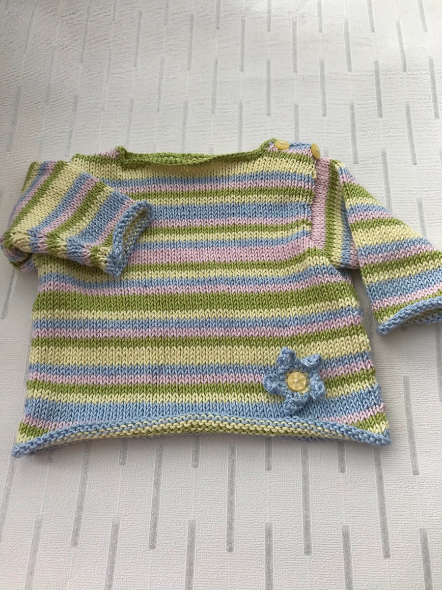 Striped jumper with flower decoration