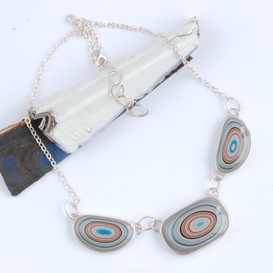 triple bullseye fordite and sterling silver necklace