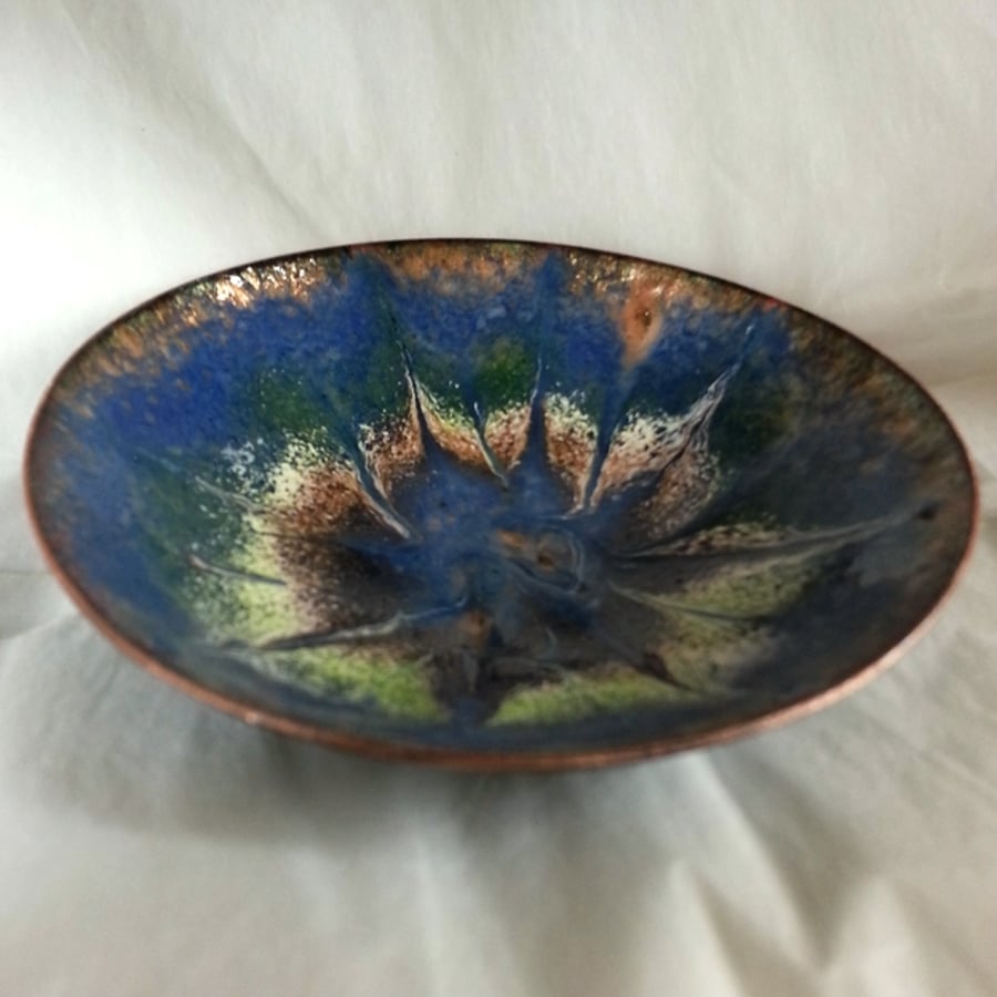 Enamel dish -scrolled blue, white purple, green and gold on blue