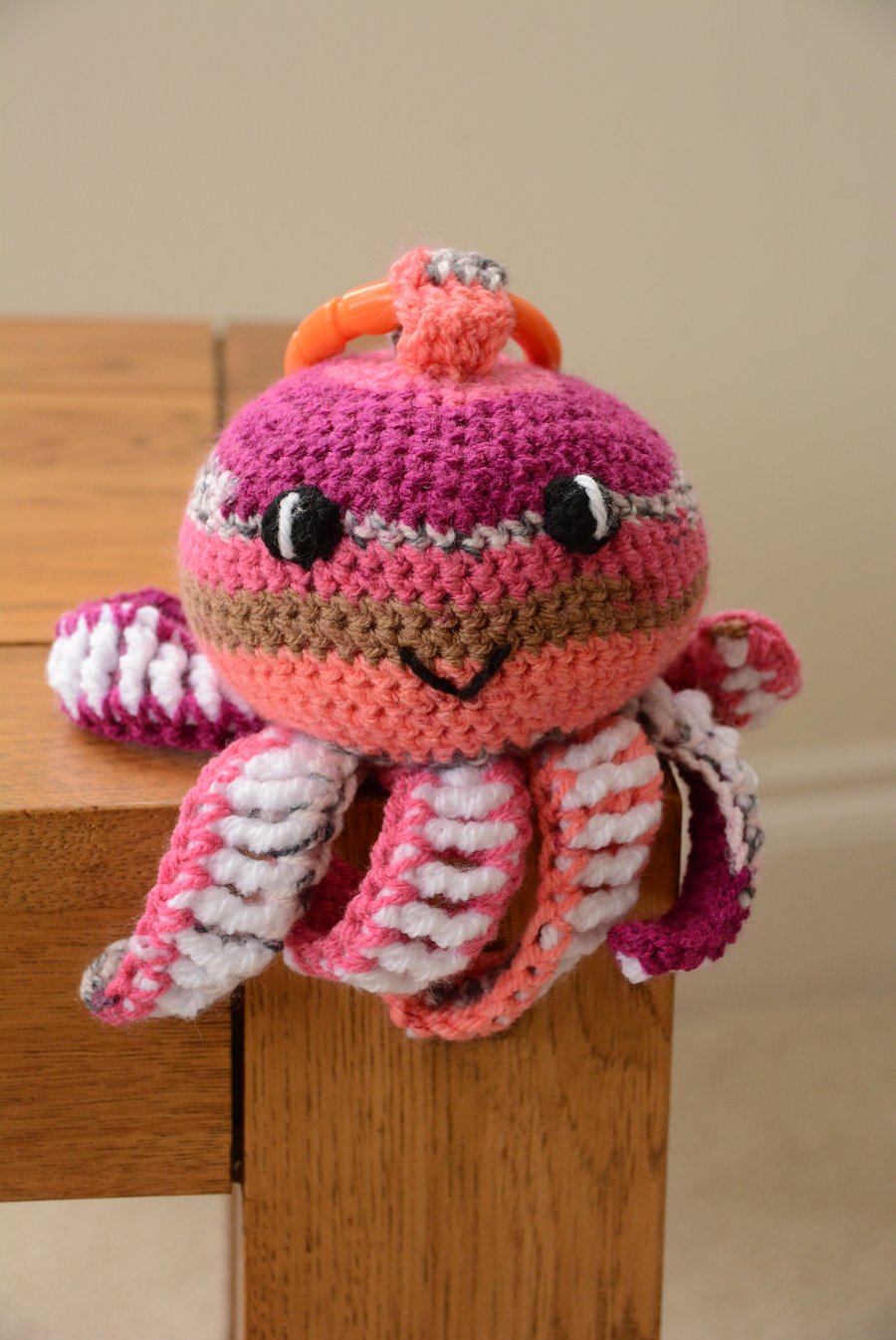 Octopus Soft Toy with teething ring and internal rattle - pink and purple