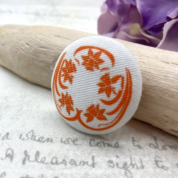 Orange Art Nouveau stylised daffodil fabric button brooch
