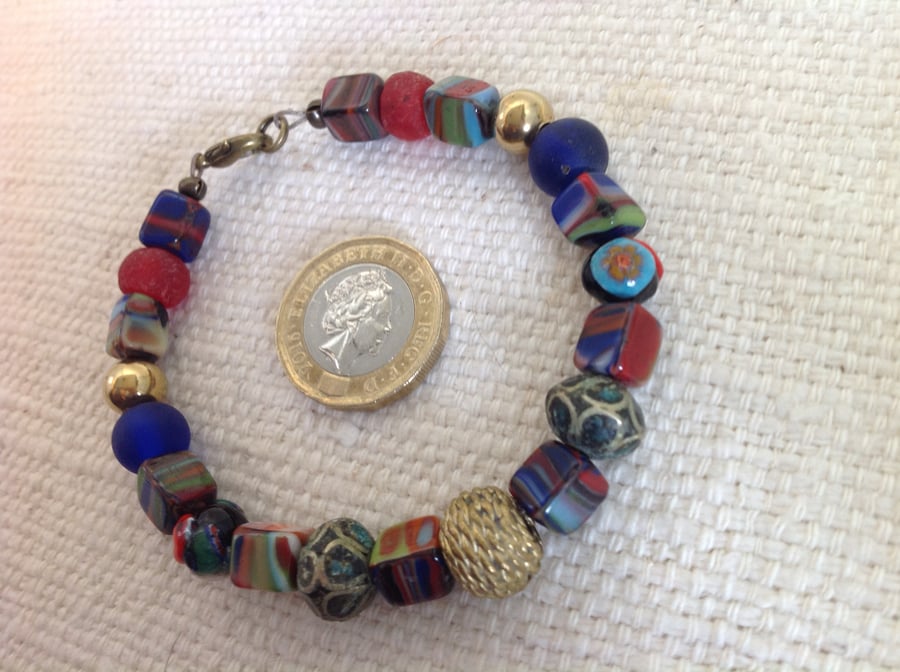 7" bead bracelet with a collection of interesting vintage glass beads 