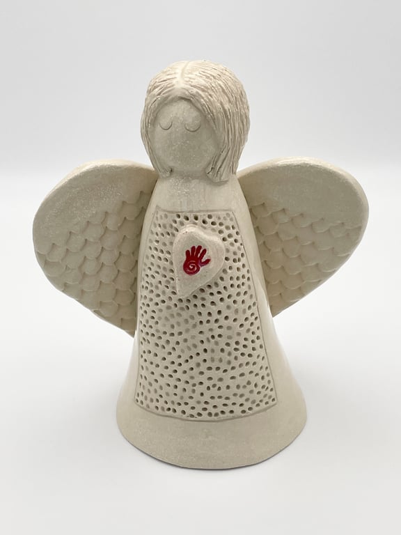 Angel sculpture with red hand symbol