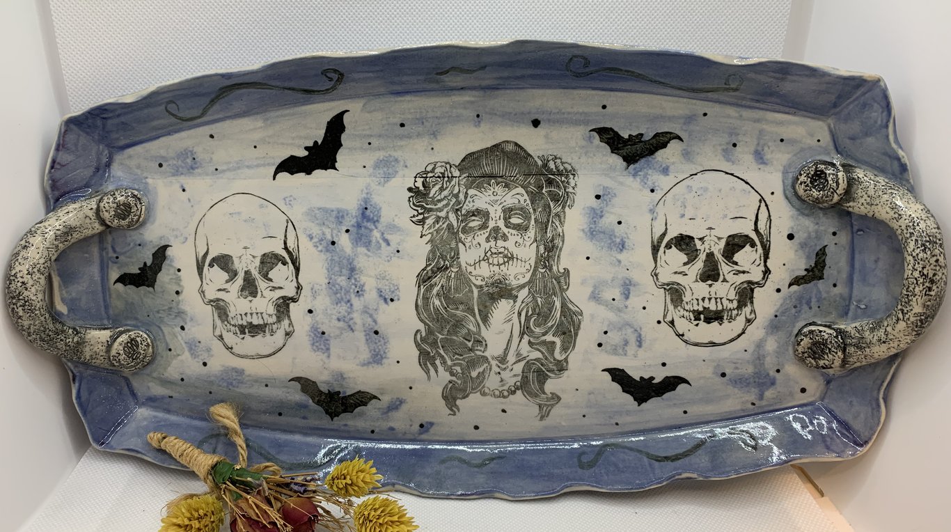 Platter decorated with skulls and goth inspired pictures.