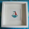 Ceramic original bobby boat picture in a white box frame