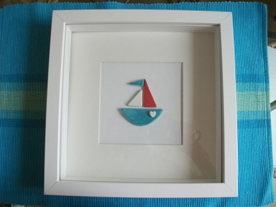 Ceramic original bobby boat picture in a white box frame