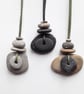 Layered Pebble Pendant with Metal Bead - Image 1