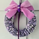 Lilac yarn wrapped wreath with velvet bow