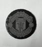 Man Utd logo on a slate coaster 