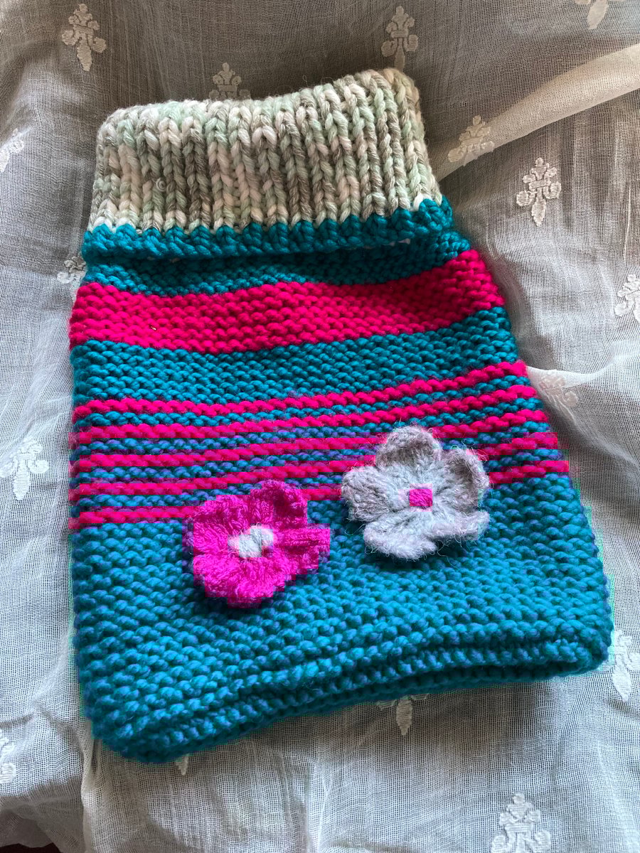 Hand knitted cosy hot water bottle cover