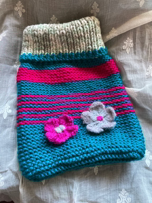 Hand knitted cosy hot water bottle cover