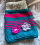 Hand knitted cosy hot water bottle cover