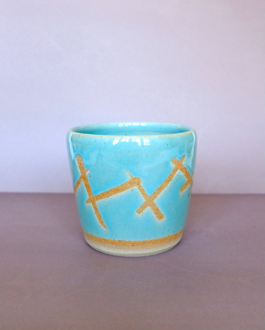 Small turquoise plant pot 