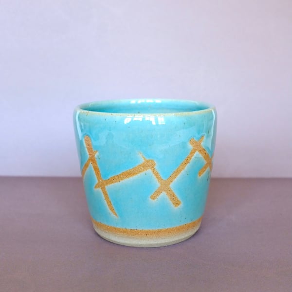 Small turquoise plant pot 