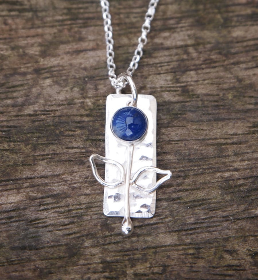 Silver flower pendant, blue sodalite necklace