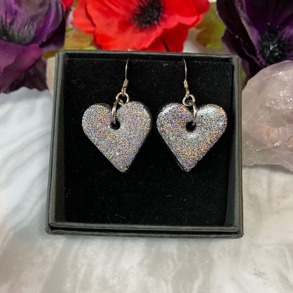 Silver heart glitter earrings made with polymer clay on sterling silver.